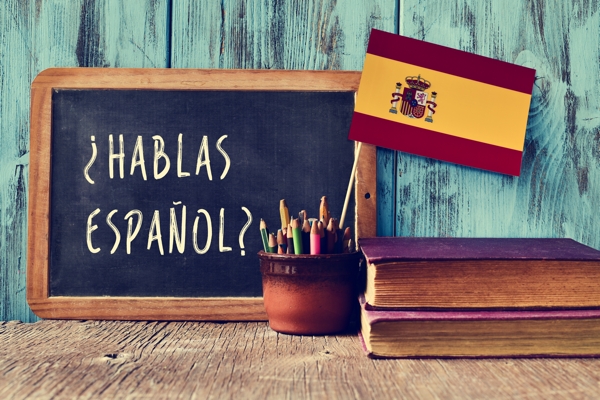 Chalkboard with Hablas Espanol written