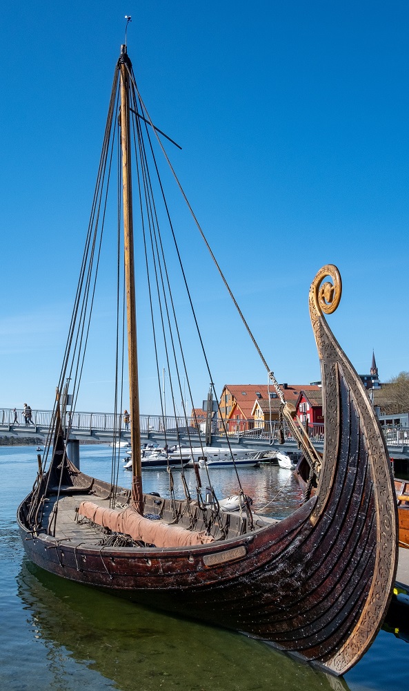 Vikings class photo of Viking boat docked with blue sky above - Continuing Education at Seattle Central College 