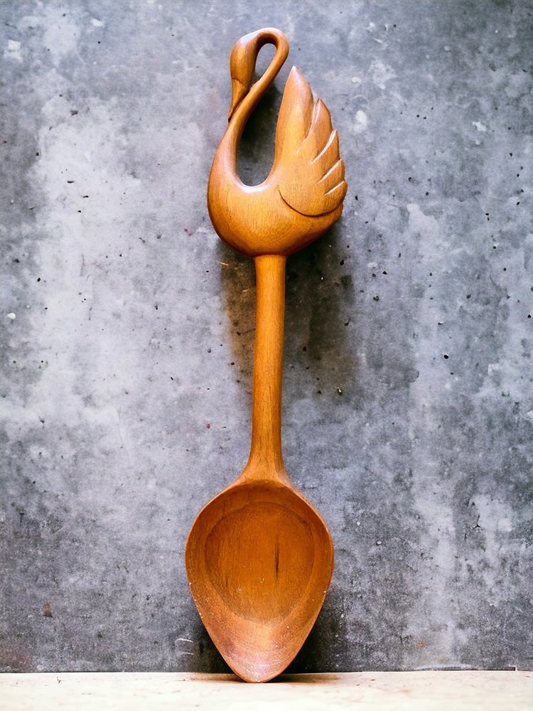 Wooden spoon with a graceful swan in an "s" shape at the top of the handle and large teardrop shape for the bowl 