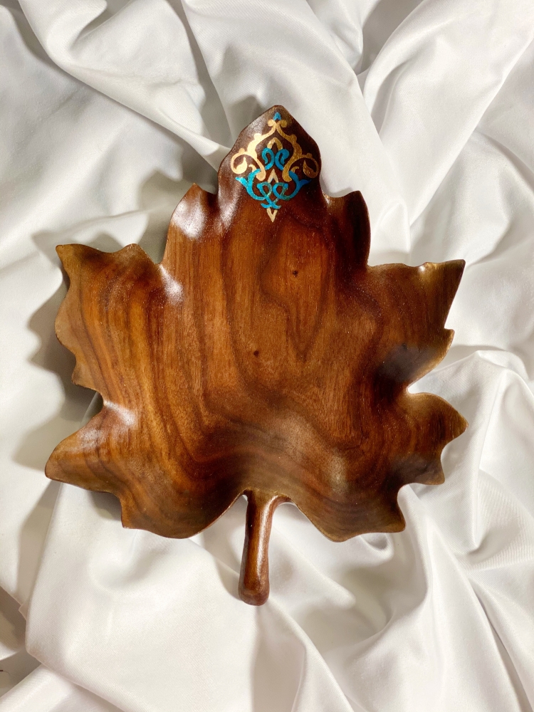 Wood bowl in shape of ornate maple leaf 